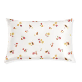A white silk pillowcase with a floral pattern.