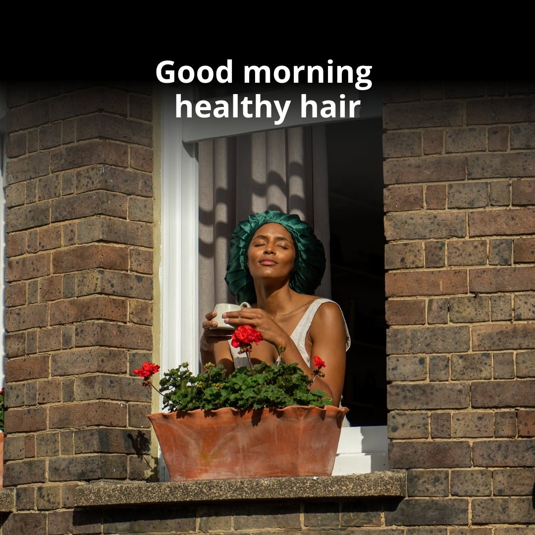 Woman hanging outside window with silk bonnet