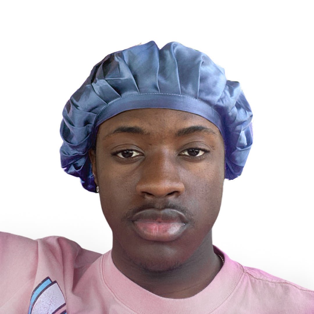 A man wearing a light blue silk sleeping cap.